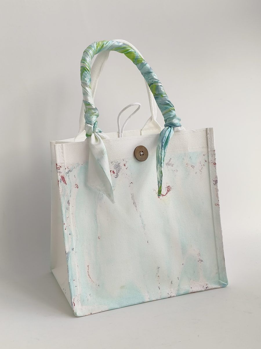 Mint Whisper original front studio view with button closure
