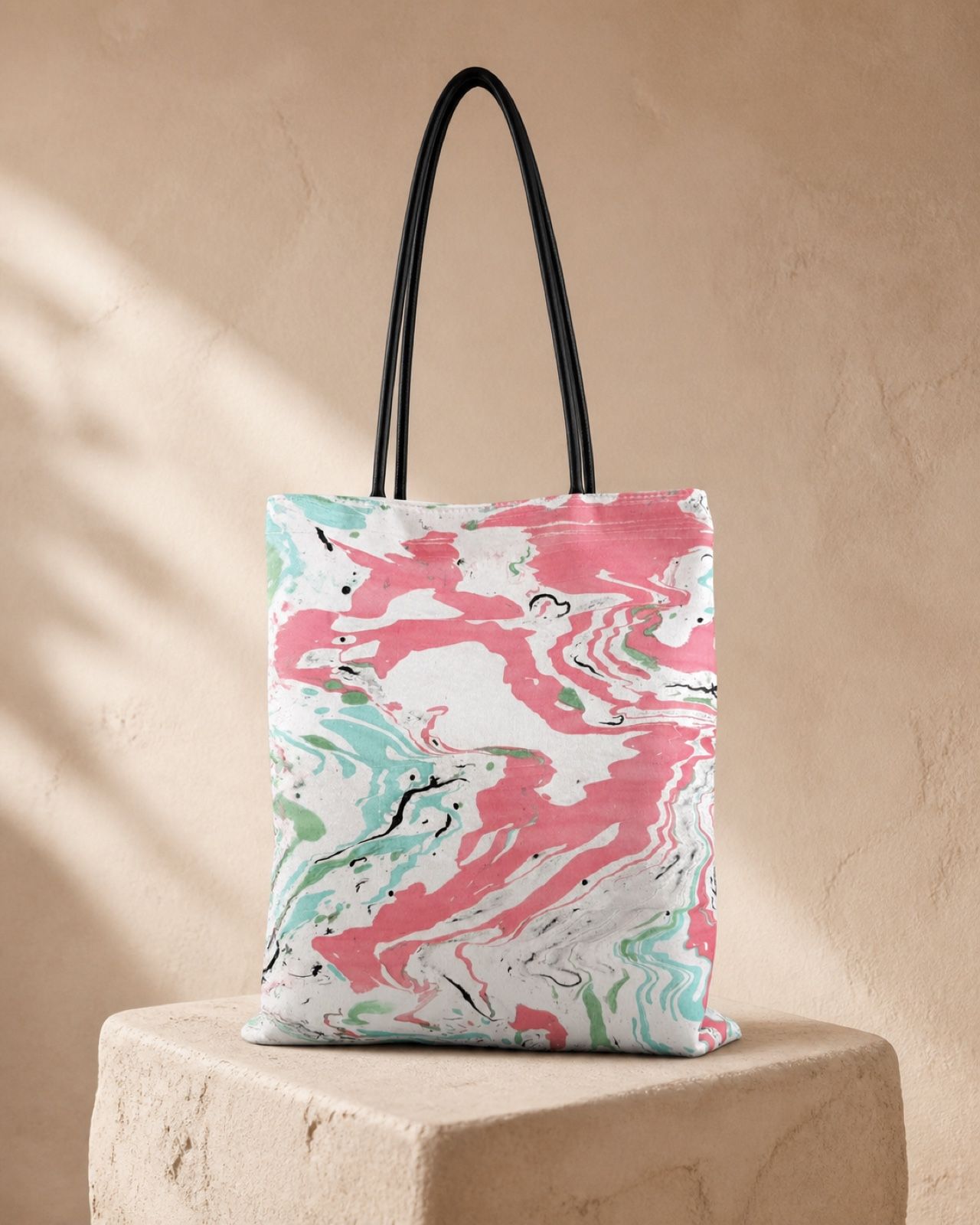 Coral Spring pink and mint velvet shoulder bag on a warm mineral plinth