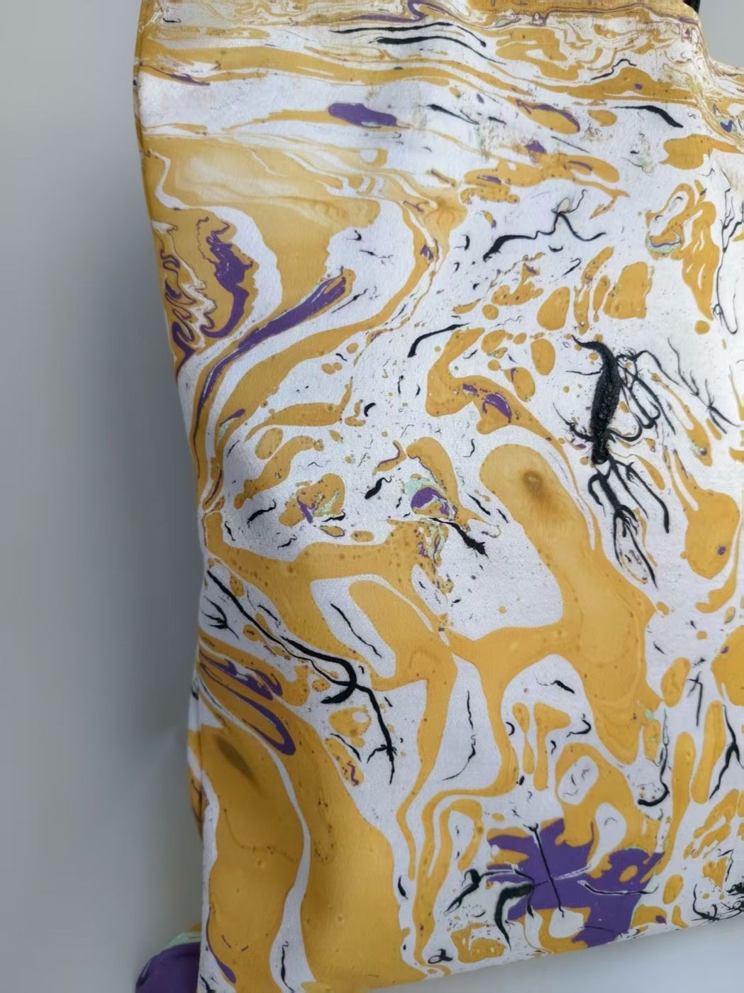 Original detail view of Golden Rain and its black straps