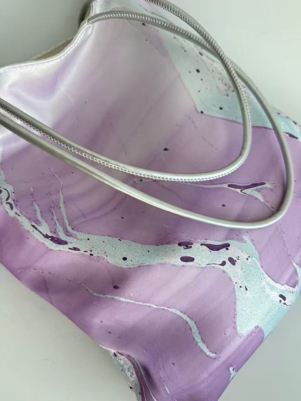 Original detail view of Violet Drift showing its lavender pattern and silver straps