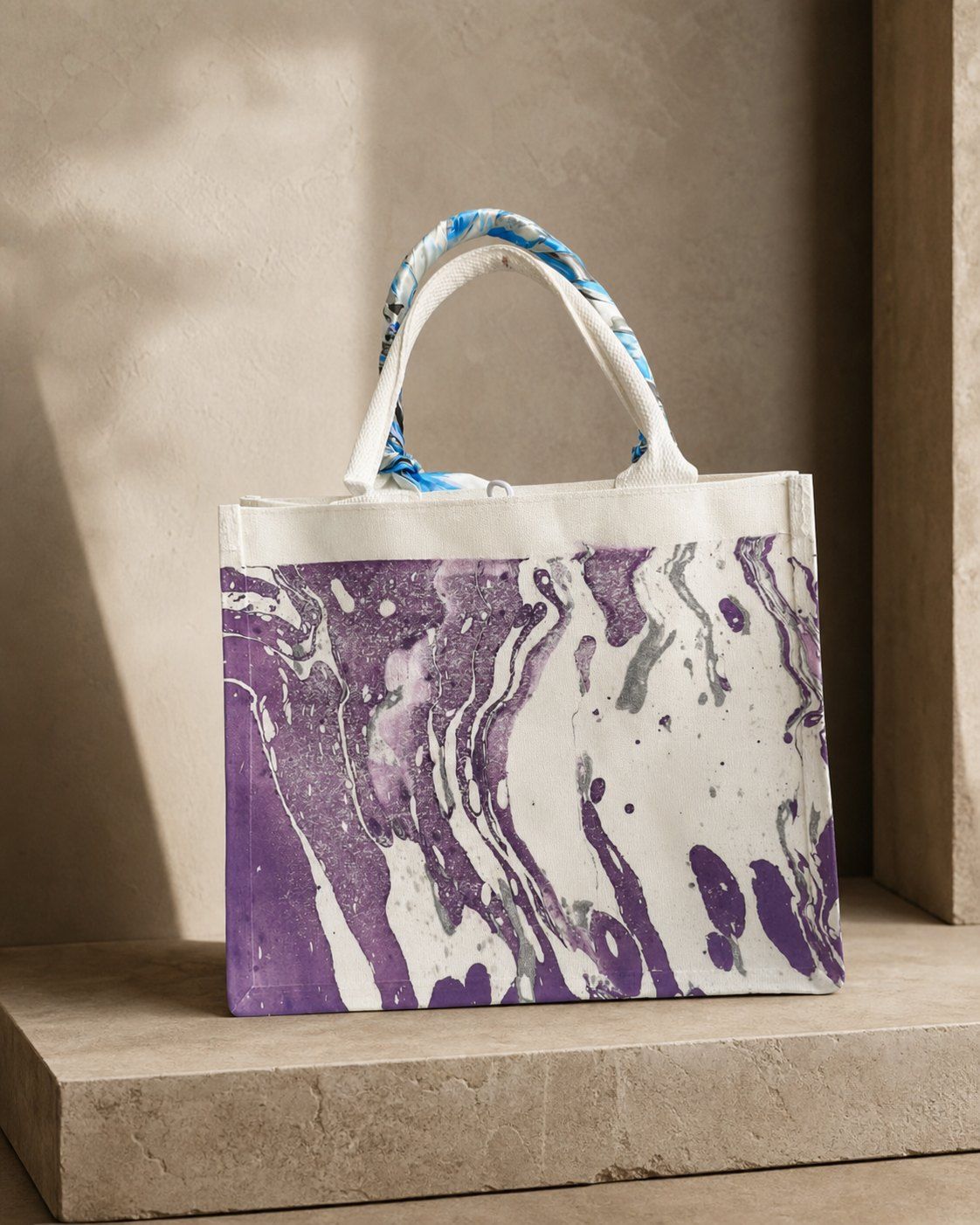 Violet Riverstone structured canvas tote on a warm mineral display plinth